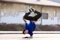 A young boy dancing breakdance on the street. Royalty Free Stock Photo