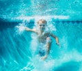 Young Boy Diving Underwater in Swimming Pool Royalty Free Stock Photo