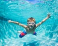 Young Boy Diving Underwater in Swimming Pool Royalty Free Stock Photo