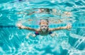 Young Boy Diving Underwater in Swimming Pool Royalty Free Stock Photo