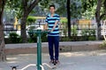 A young boy doing exercise in public park Delhi in India.