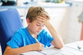 Young boy doing his homework at home. School kid learning. Royalty Free Stock Photo