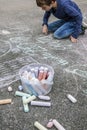 Young boy drawing on the sidewalk with chalk Royalty Free Stock Photo