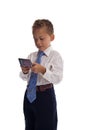 Young boy dressed as businessman sends SMS