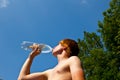 Young boy drinks water out Royalty Free Stock Photo