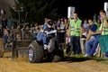 A Young Boy Drives at a Lawn Tractor Pull