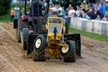 A Young Boy Drives at a Lawn Tractor Pull