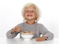 Young boy eating breakfast Royalty Free Stock Photo