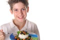 Young boy eating healthy rice, beans & veggies