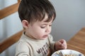 young boy eating oatmeal for breakfast Royalty Free Stock Photo