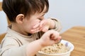 young boy eating oatmeal for breakfast Royalty Free Stock Photo