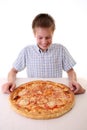 Young boy eating pizza Royalty Free Stock Photo