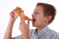 Young boy eating pizza Royalty Free Stock Photo