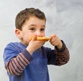 Young boy eating pizza Royalty Free Stock Photo