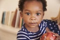 Young Boy Eating Red Apple At Home Royalty Free Stock Photo