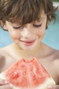 Young Boy Eating Slice Of Watermelon Royalty Free Stock Photo