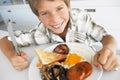 Young Boy Eating Unhealthy Fried Breakfast Royalty Free Stock Photo