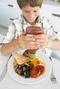 Young Boy Eating Unhealthy Fried Breakfast Royalty Free Stock Photo