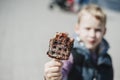 Young boy eating waffles for breakfast. Belgian waffles Royalty Free Stock Photo