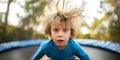 Young Boy With Electrified Hair Poses Humorously On Trampoline For Portrait