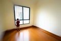 Young boy in an empty room