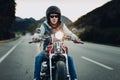 Young boy enjoying his motorcycle on the road at sunset Royalty Free Stock Photo