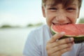 Young boy enjoying sweet watermelon