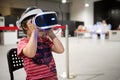 Young boy exploring computer simulation using virtual reality glasses