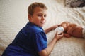 Boy feeding newborn baby with bottle of milk Royalty Free Stock Photo