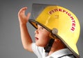 Young boy in Fireman's Helmet