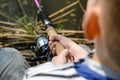 Young boy fishing with a spinning reel Royalty Free Stock Photo