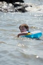 Young boy floating in inner tubes in a blissful state Royalty Free Stock Photo