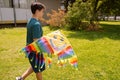 Teenage Boy flying kite on a sunny day Royalty Free Stock Photo