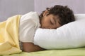 Young boy fully sleeping in his bed Royalty Free Stock Photo