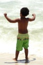 Young Boy Gazing Out At The Ocean