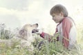 Young Boy Gently Caresses His Dog