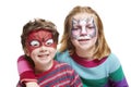 Young boy and girl with face painting cat and spiderman Royalty Free Stock Photo