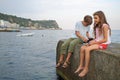 A young boy and girl fishing in the sea with a Royalty Free Stock Photo