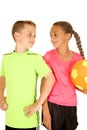 Young boy and girl holding a soccer ball with an attitude Royalty Free Stock Photo