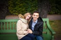 Young boy and girl hugging and kissing, sitting on the bench Royalty Free Stock Photo