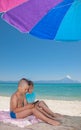 Young Boy Girl Playing Smartphone Beach shade Royalty Free Stock Photo