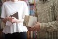 Young boy and girl students with books in the library Royalty Free Stock Photo