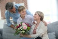 Young boy giving flowers to his mother Royalty Free Stock Photo