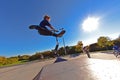 Young boy going airborne with scooter Royalty Free Stock Photo