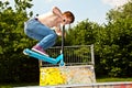 Young boy going airborne with a scooter Royalty Free Stock Photo