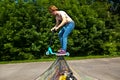 Young boy going airborne with a scooter Royalty Free Stock Photo