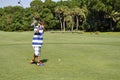 Young boy golfing Royalty Free Stock Photo