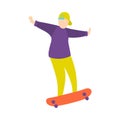 Young boy in green baseball cap does trick on skateboard