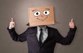 Young boy with happy cardboard box face