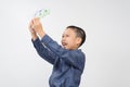 Young boy with happy and smile with korean won bank note Royalty Free Stock Photo